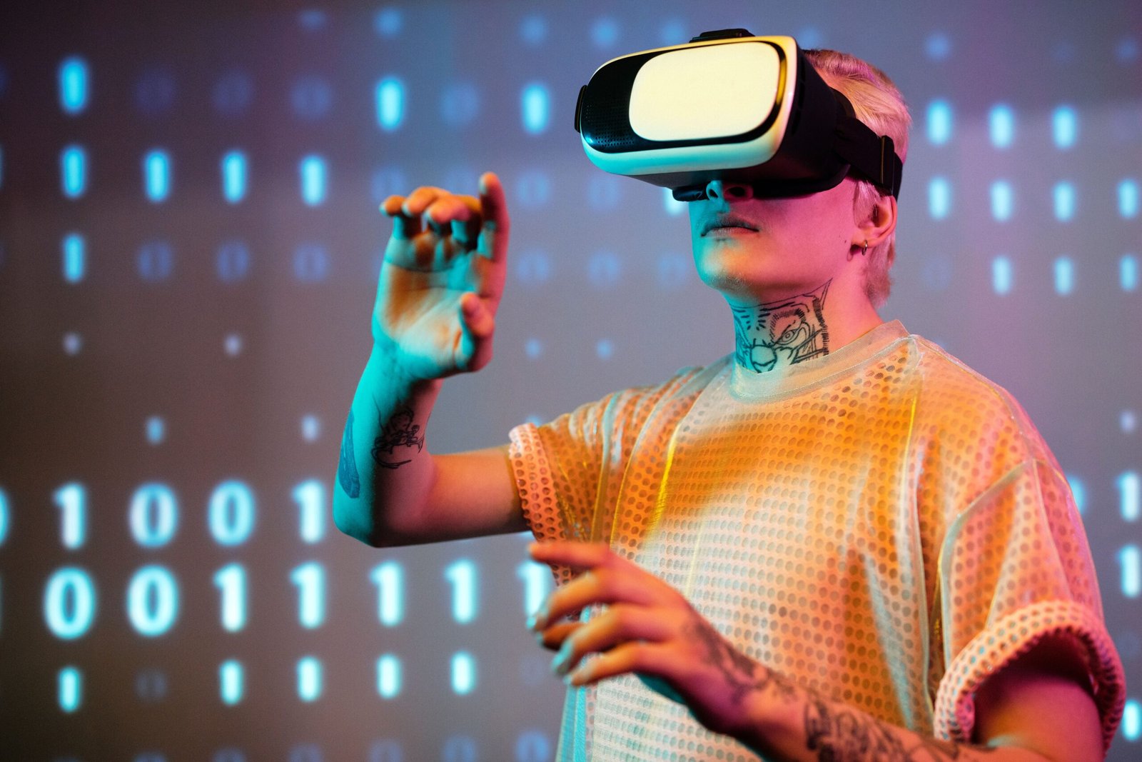 About A young man interacts in virtual reality wearing a headset with a digital binary background.